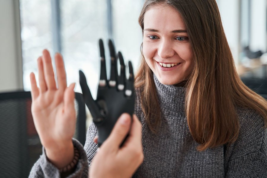 custom prosthetic fitting happy customer seeing custom prosthetic hand for the first time